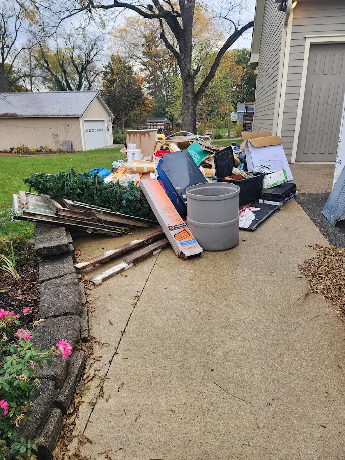 Dumpster being loaded with debris for 3 Yard Dumpster Rental in Paloma Creek